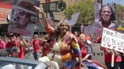 Miss Major Griffic Gracy sitting on a float in a protest march for trans rights